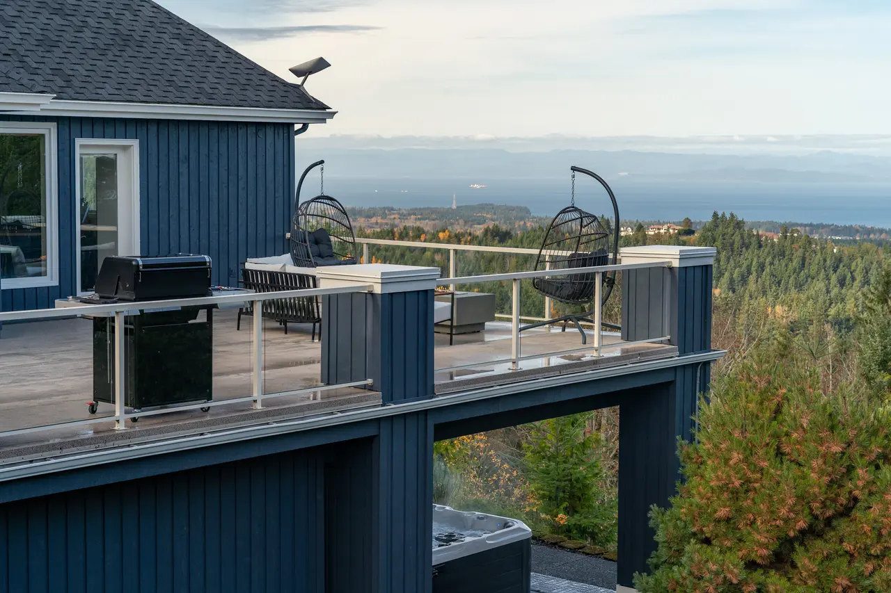 Treat this expansive two-story deck as your private resort, featuring a hot tub, fire pit, and world-class views.