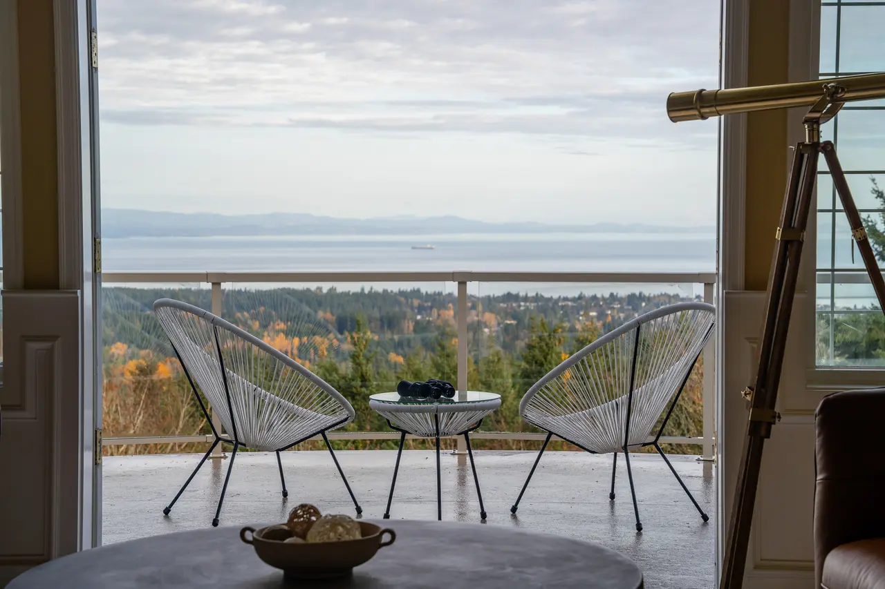 High-powered binoculars and a antique telescope bring the passing ships and Canadian coastline even closer.