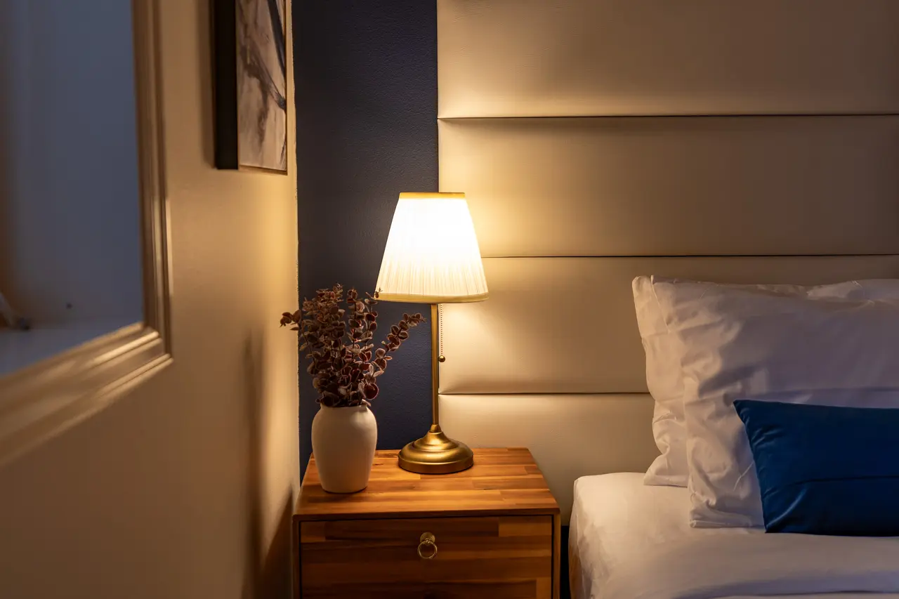 Warm glowing light on the nightstand for every guest in your private resort.