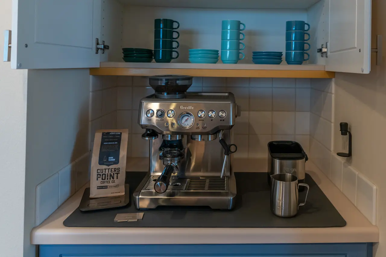 Your morning coffee bar, featuring a high-end Breville espresso machine, grinder, and local coffee beans to start your day right.
