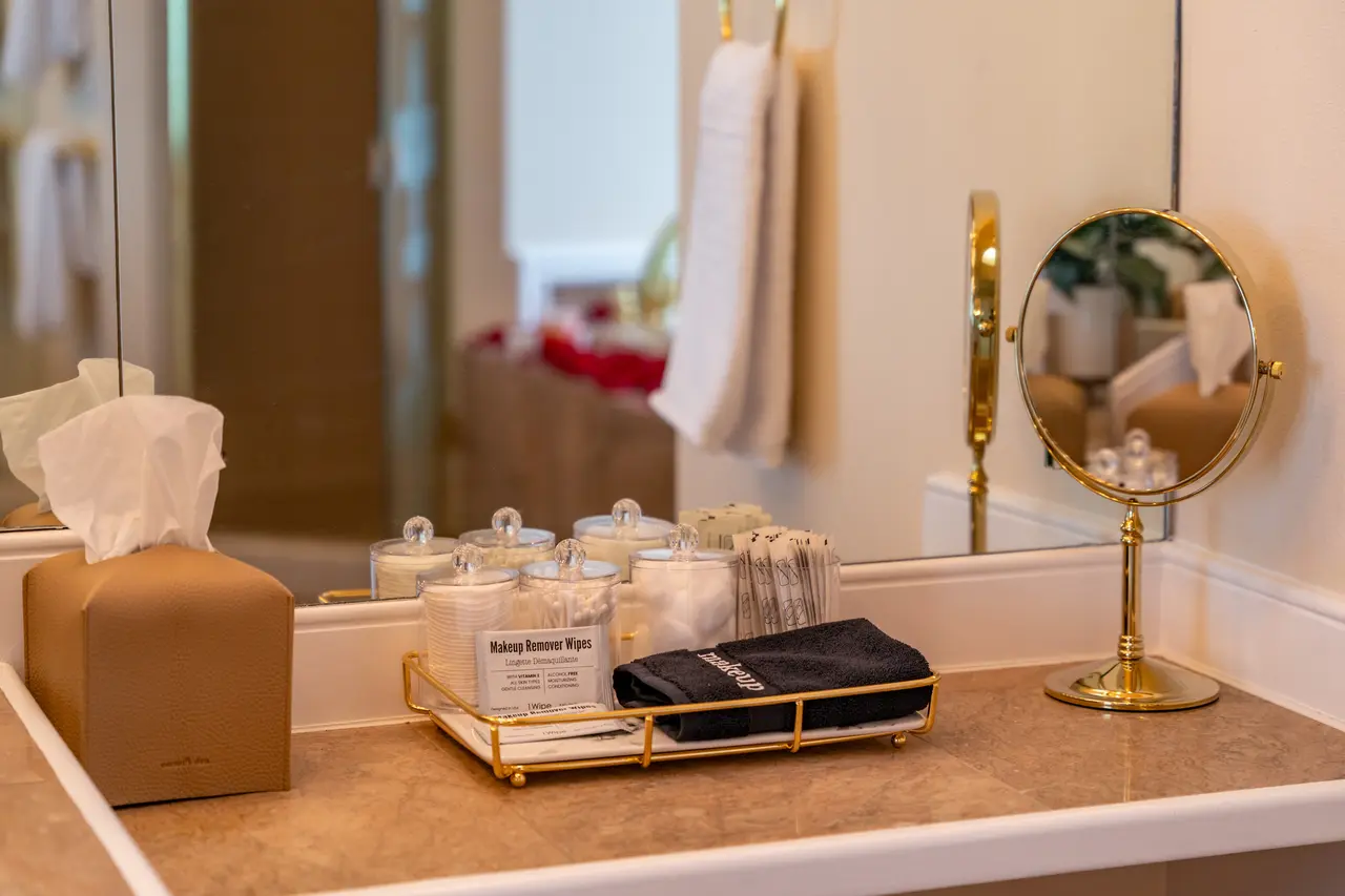 Perfection is in the details. The grand, dual-sink vanity features a dedicated, brightly-lit makeup station. 