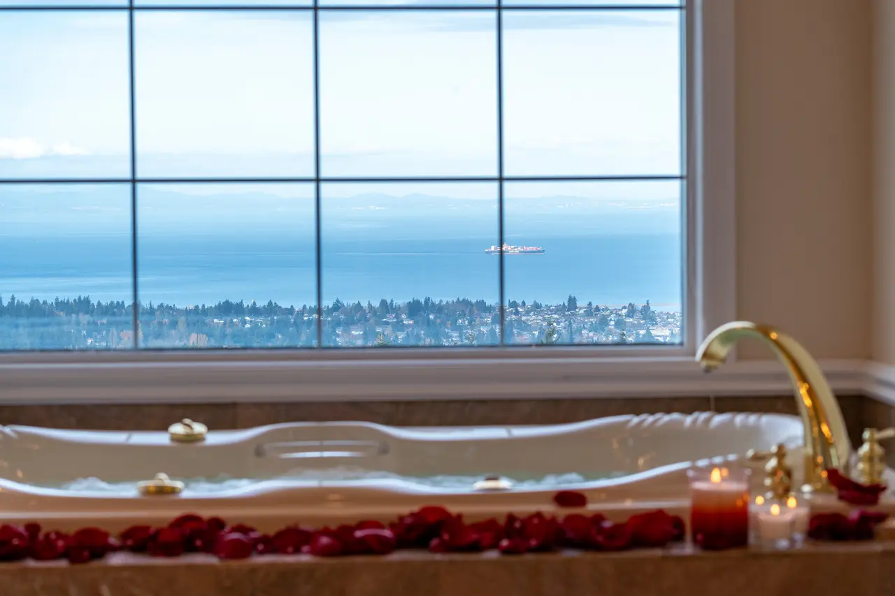 Enjoy a truly romantic escape, soaking in the jetted tub with unparalleled views of the Strait.