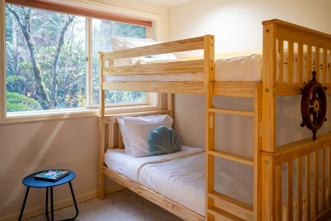Tucked away on the garden level, this quiet and cozy retreat stays naturally cool—perfect for sleeping in without the early morning glare.
